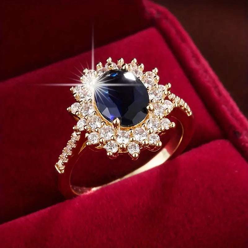 Delphine – Schicker goldener Ring mit blauem Stein